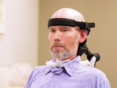 image of Steve Gleason using assistive technology 