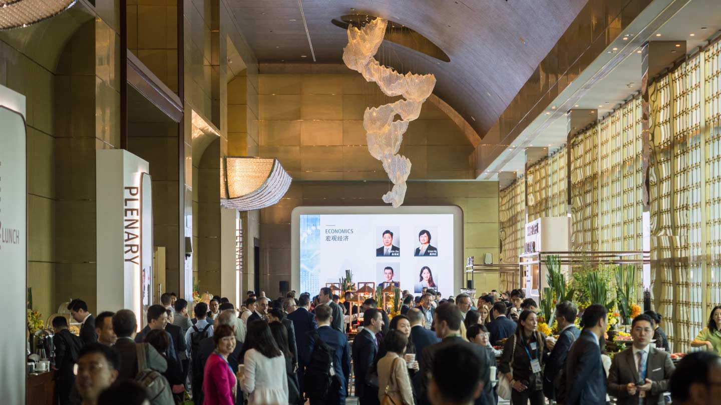Overhead view of conference, screen in the back