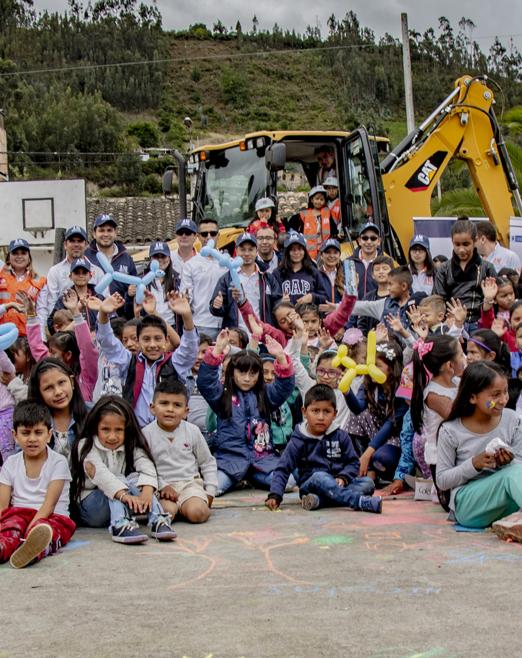 smiling colombian children with highway builders