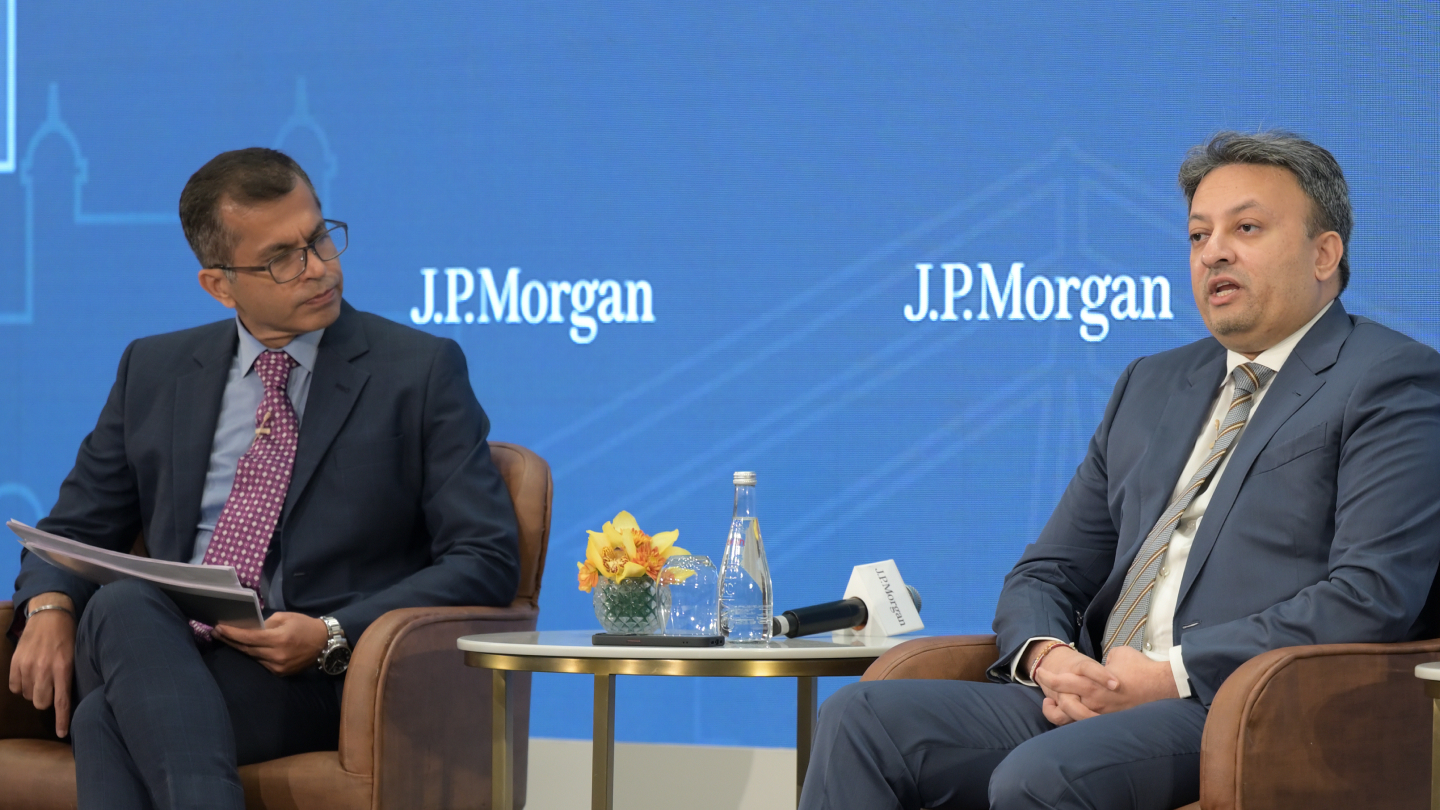 Two men speaking on stage