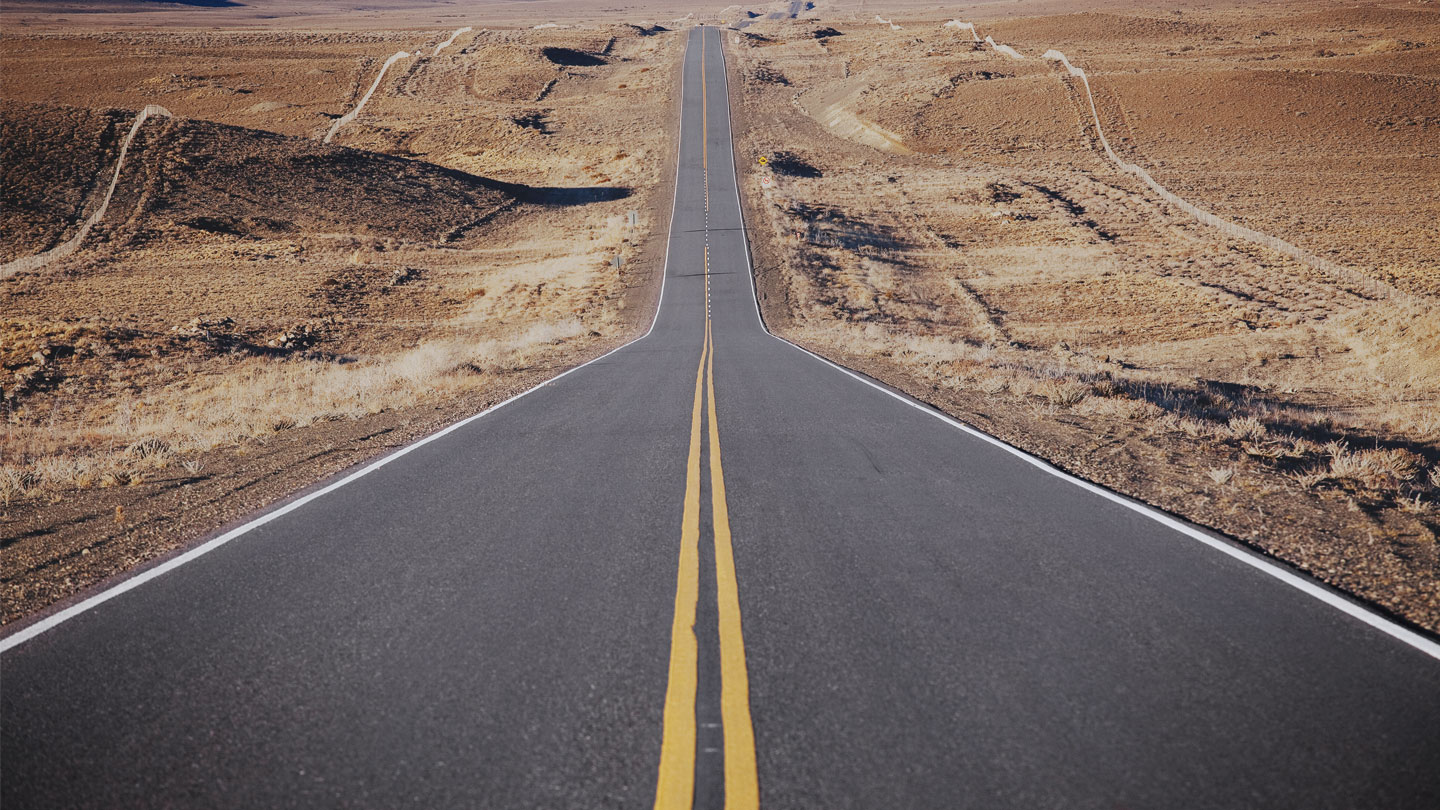 Desert road leading into the distance