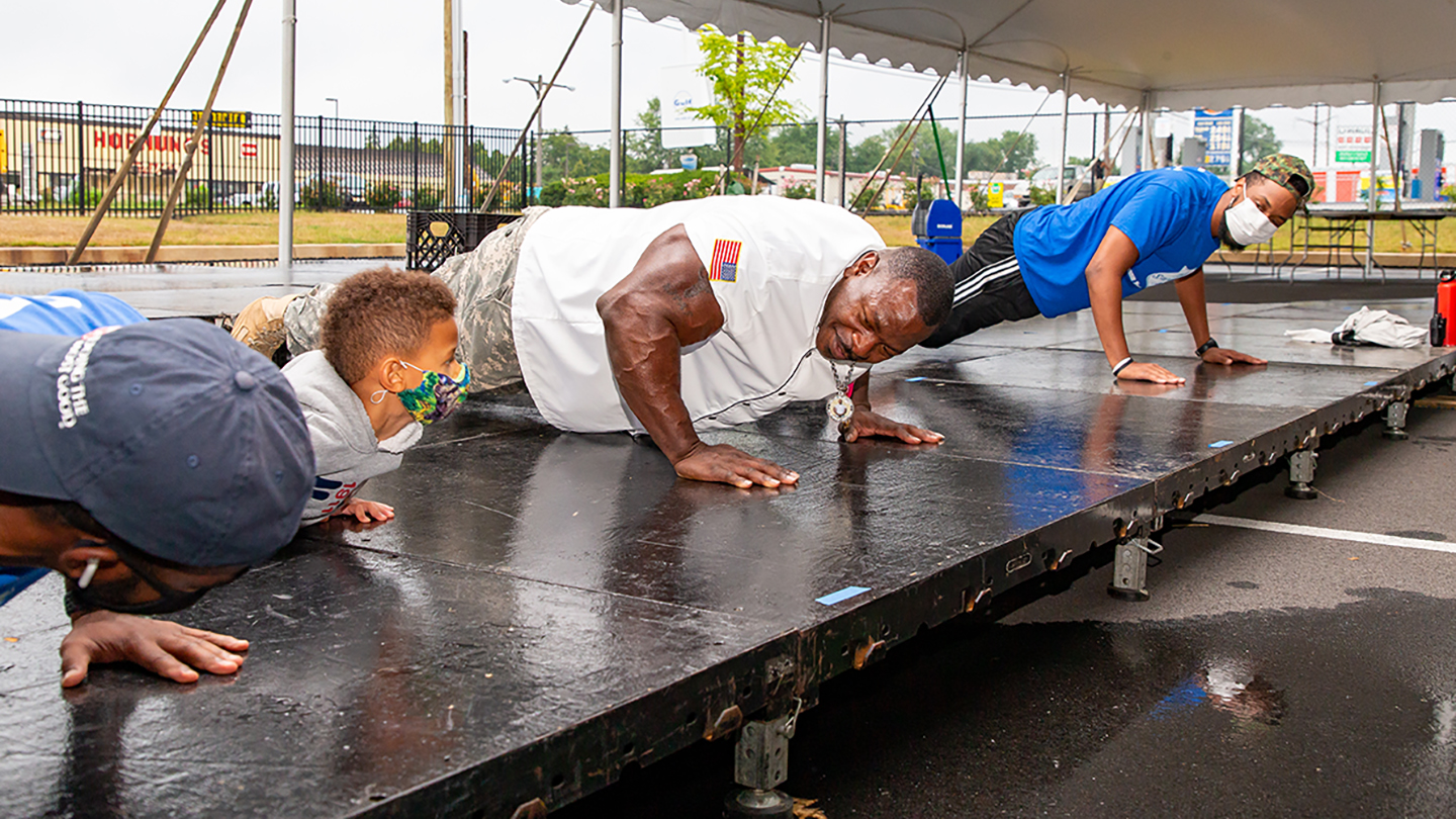 Group of people doing push ups together