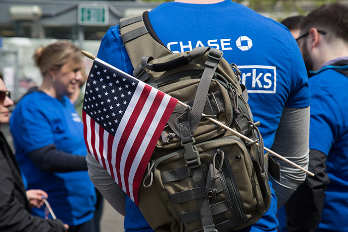 JPMorgan Chase employee wearing a backpack with a U.S. flag attached