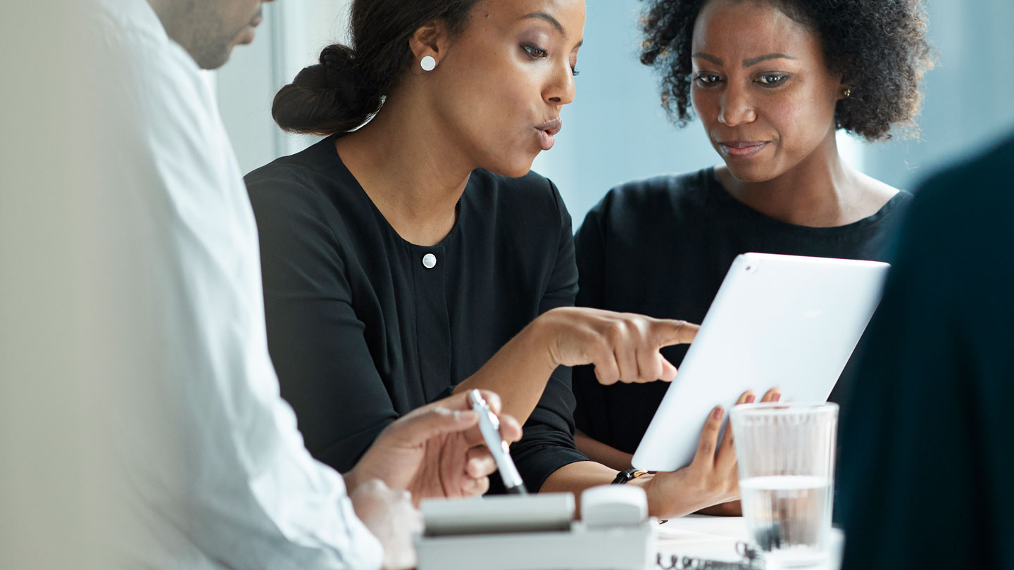 Women looking over a tablet