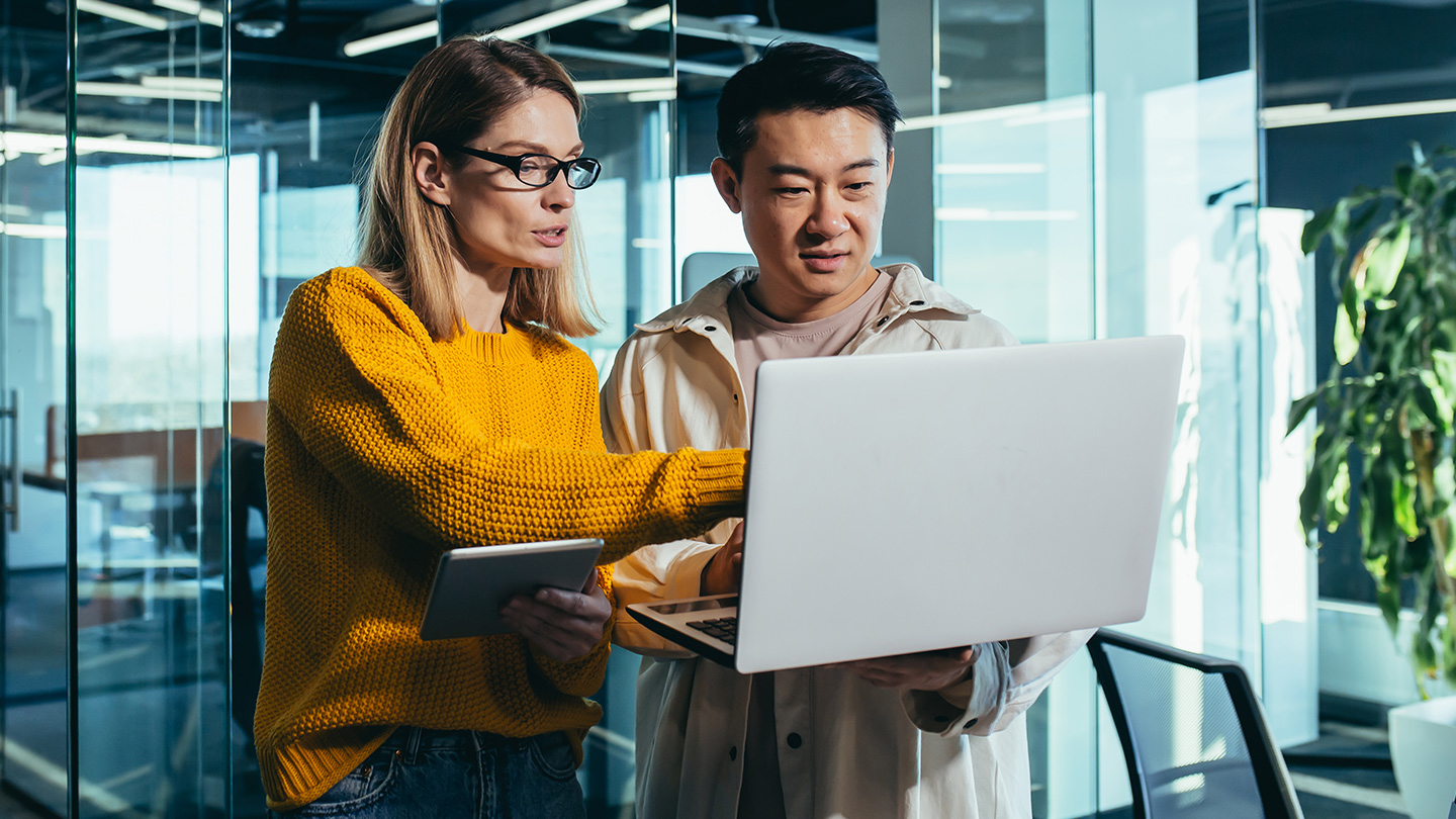 Two people looking at computer