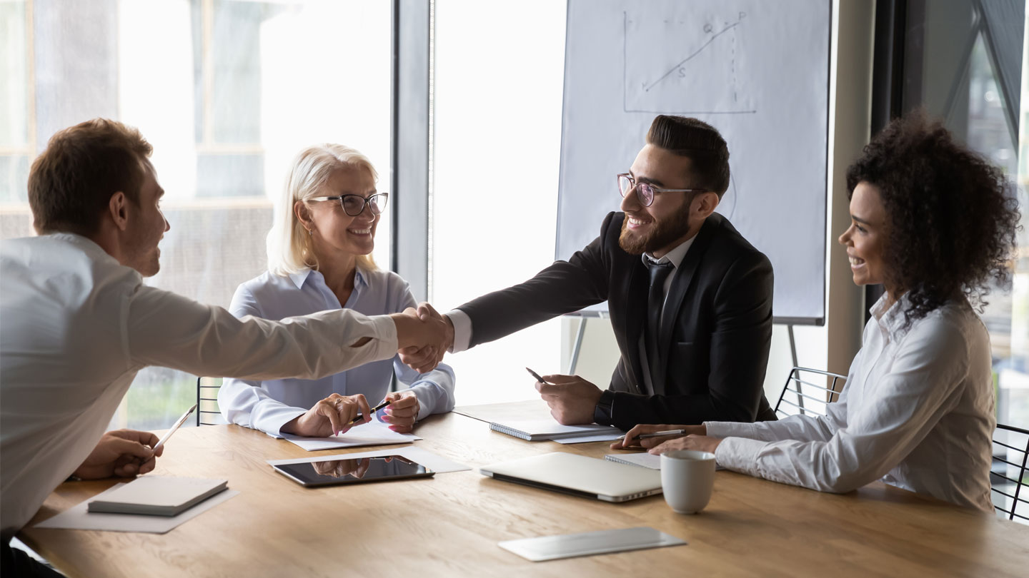 Work colleagues shaking hands