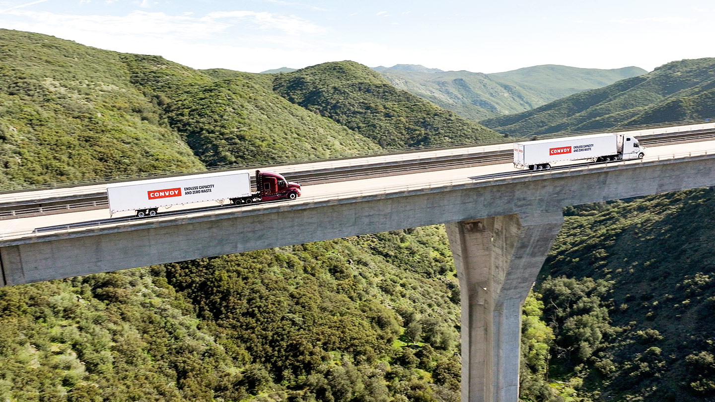 Two Convoy Trucks on Highway Road