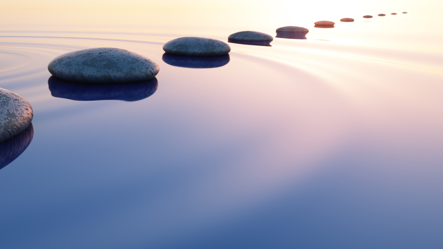 Stones along water