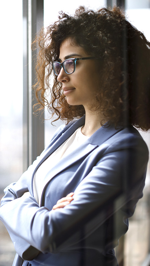 Woman standing near window