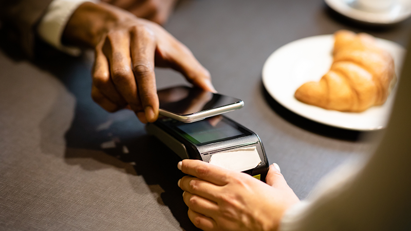 Paying with mobile phone at restaurant using virtual card