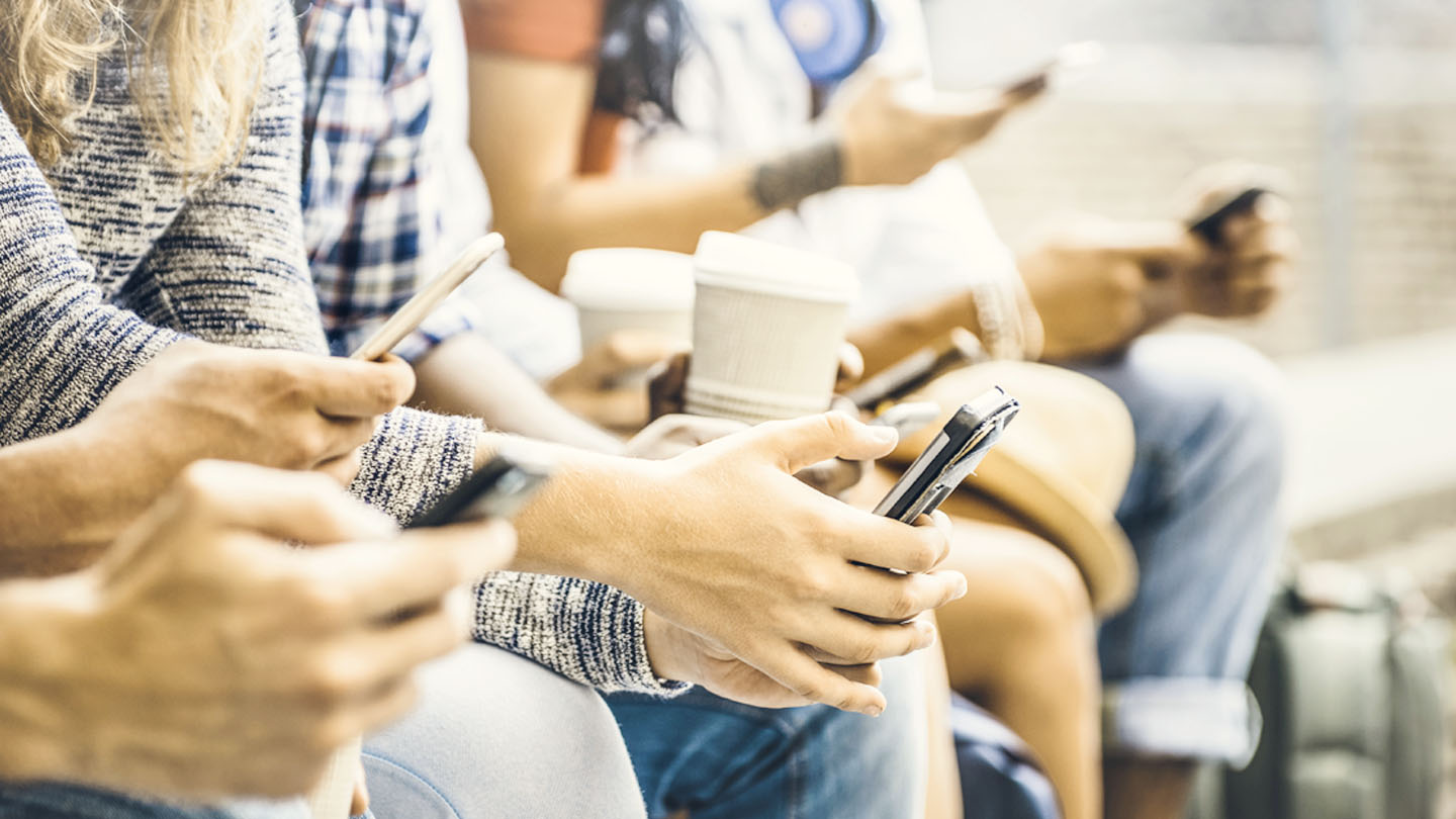 Multicultural friends group using smartphone with coffee at university college break - People hands addicted by mobile smart phone - Technology concept with connected trendy millennials - Filter image