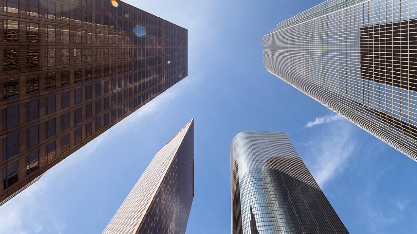 This view from Bunker Hill in downtown Los Angeles looks up at modern office towers along Grand Avenue. The buildings seen here are California Plaza and Wells Fargo Center.