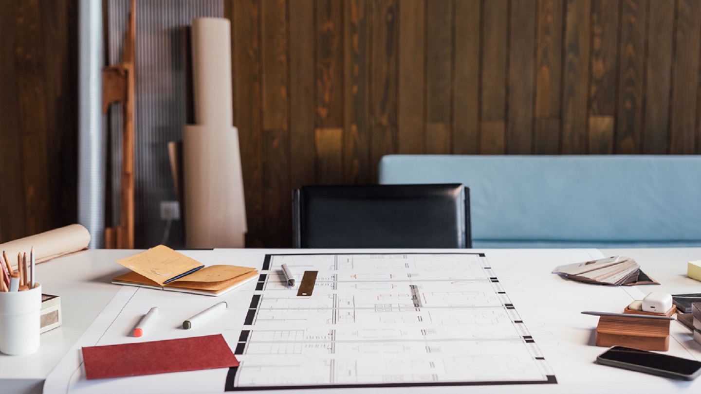 A shot of an architect's desk in the office.