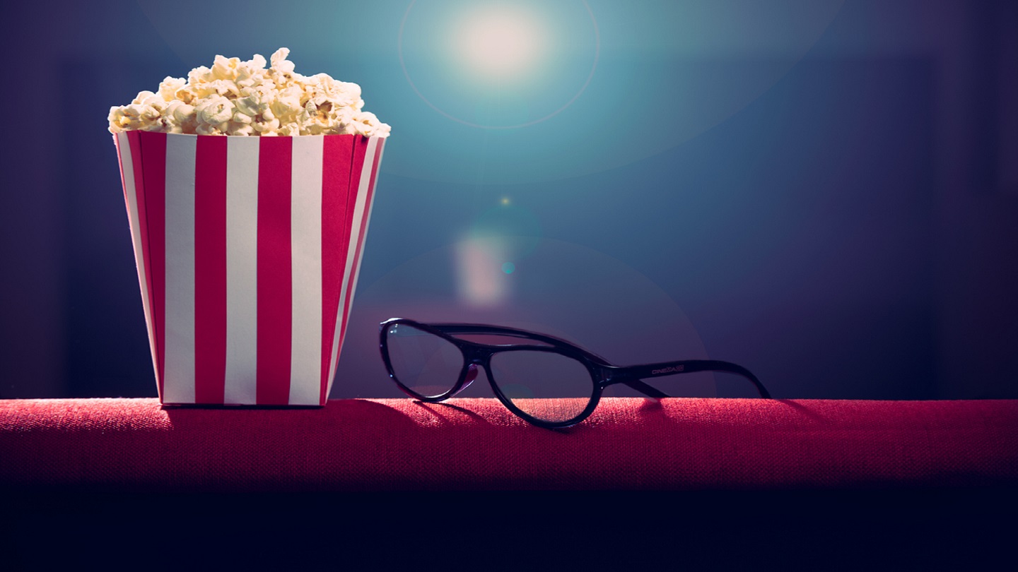 pop corn and 3d glasses on armchair cinema