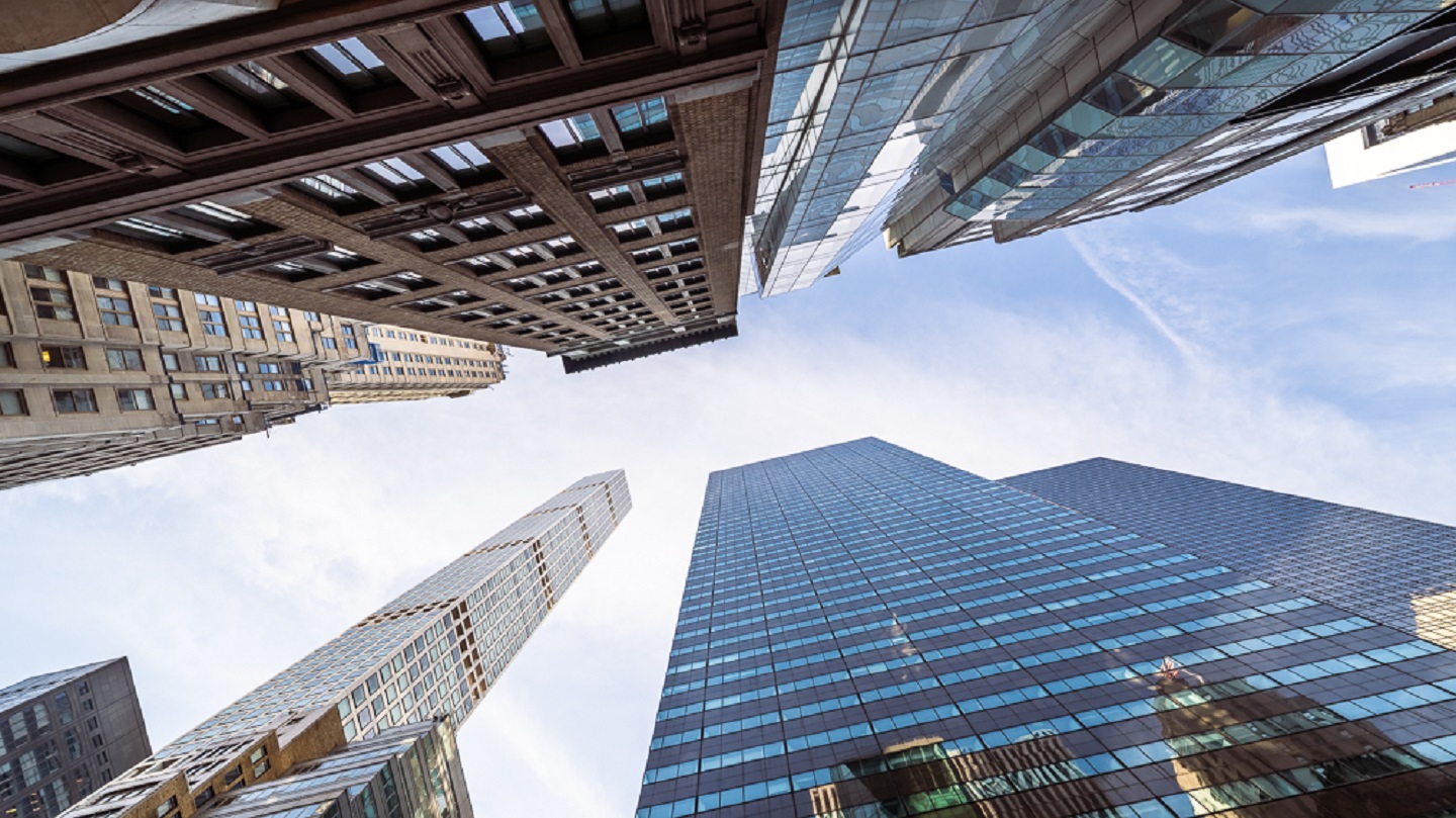 This view from West 57th Street in Midtown Manhattan looks up at the tall buildings along the street. Some of the buildings seen here are 432 Park Avenue, 590 Madison Avenue and 598 Madison Avenue.