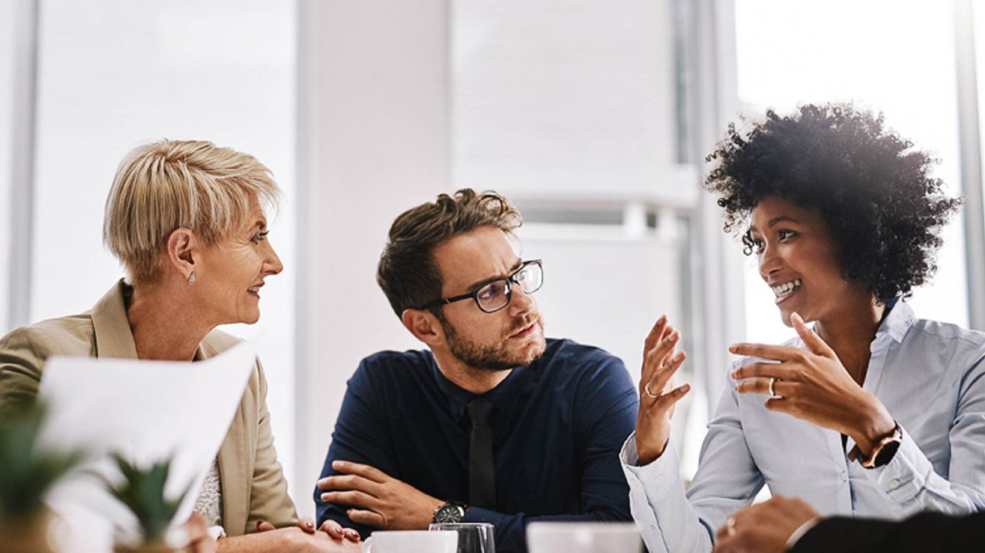 Shot of a group of businesspeople sitting together in a meeting