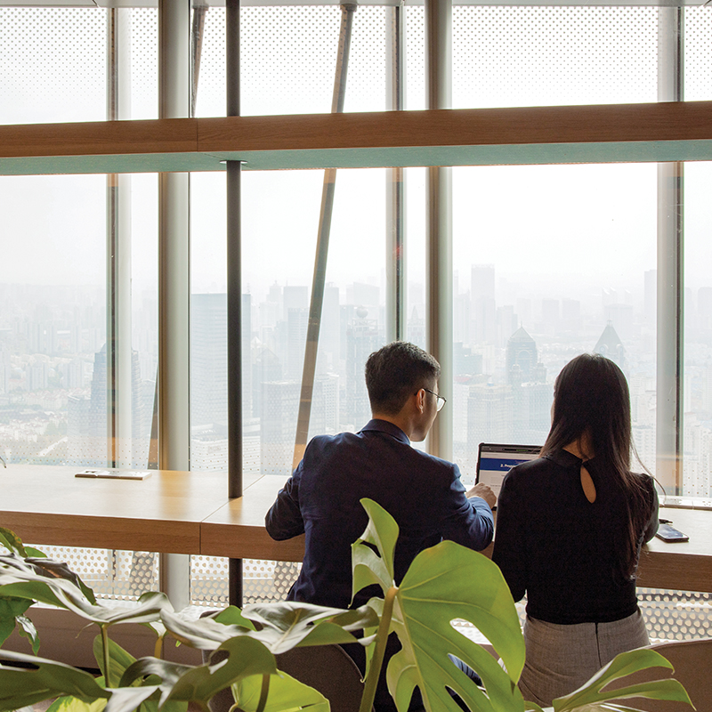 Two people collaborating at a desk