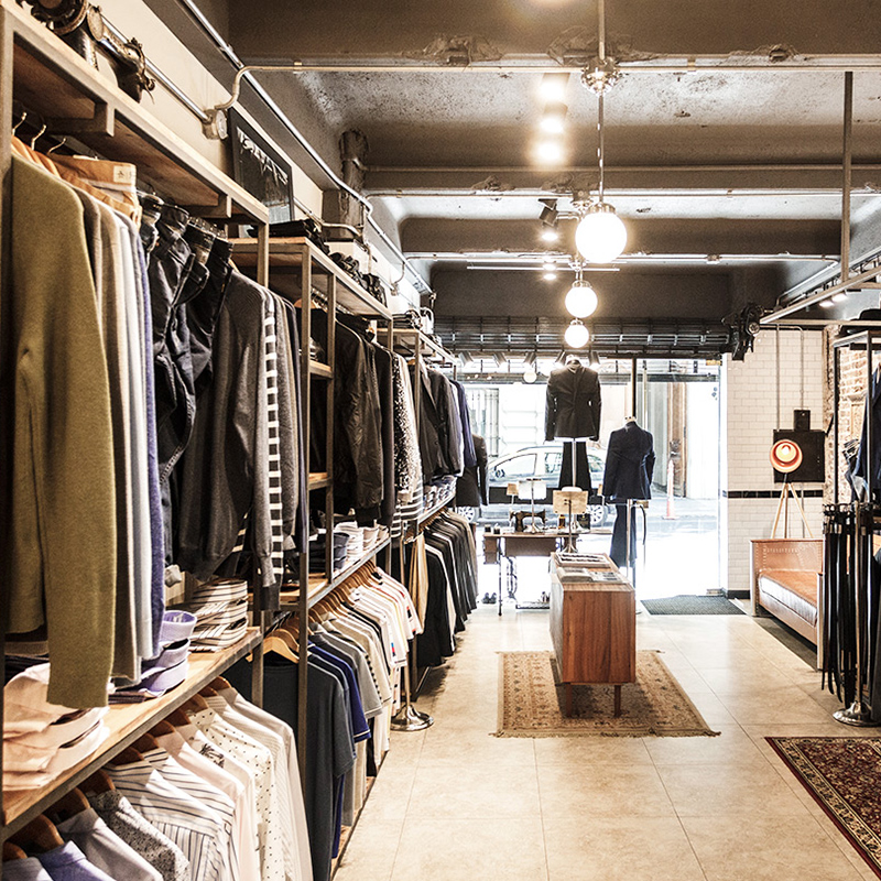 Inside a retail store with clothing racks