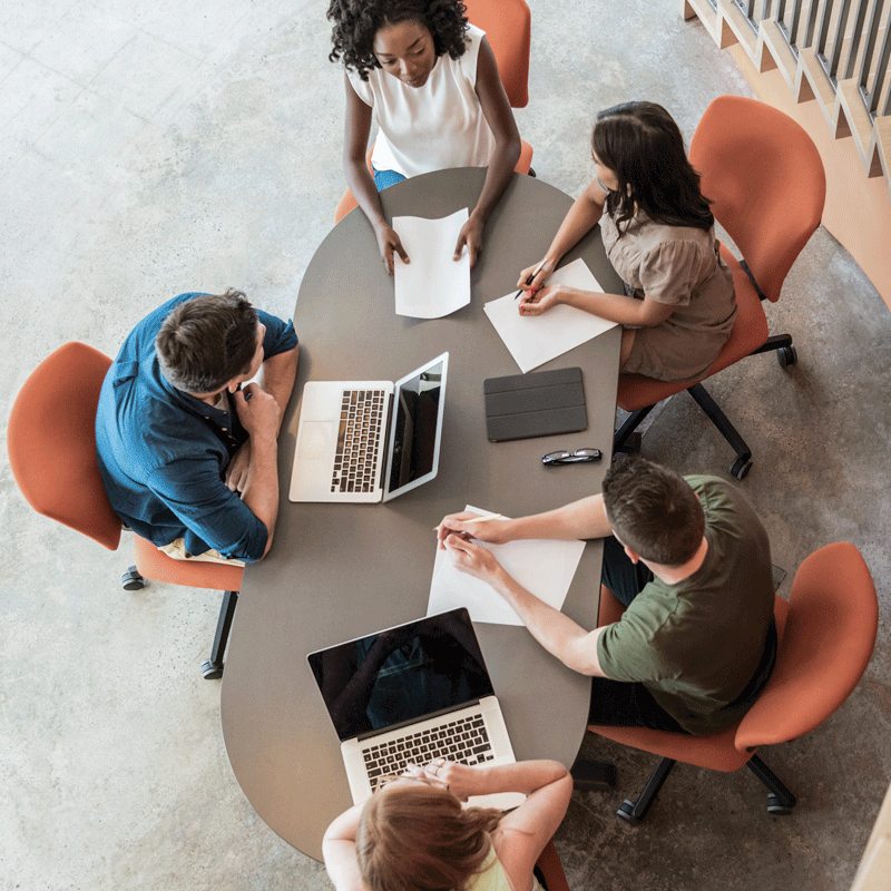 Aerial view of people working at a table