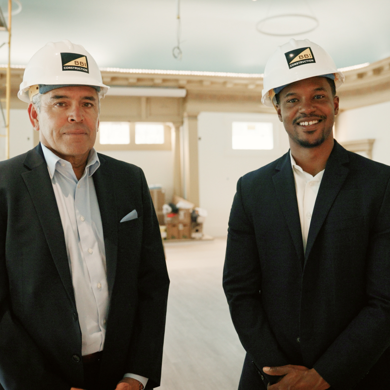 Two men with construction hats