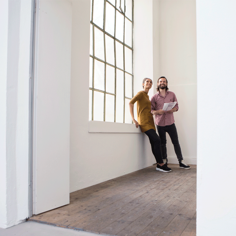 Two people in an empty home