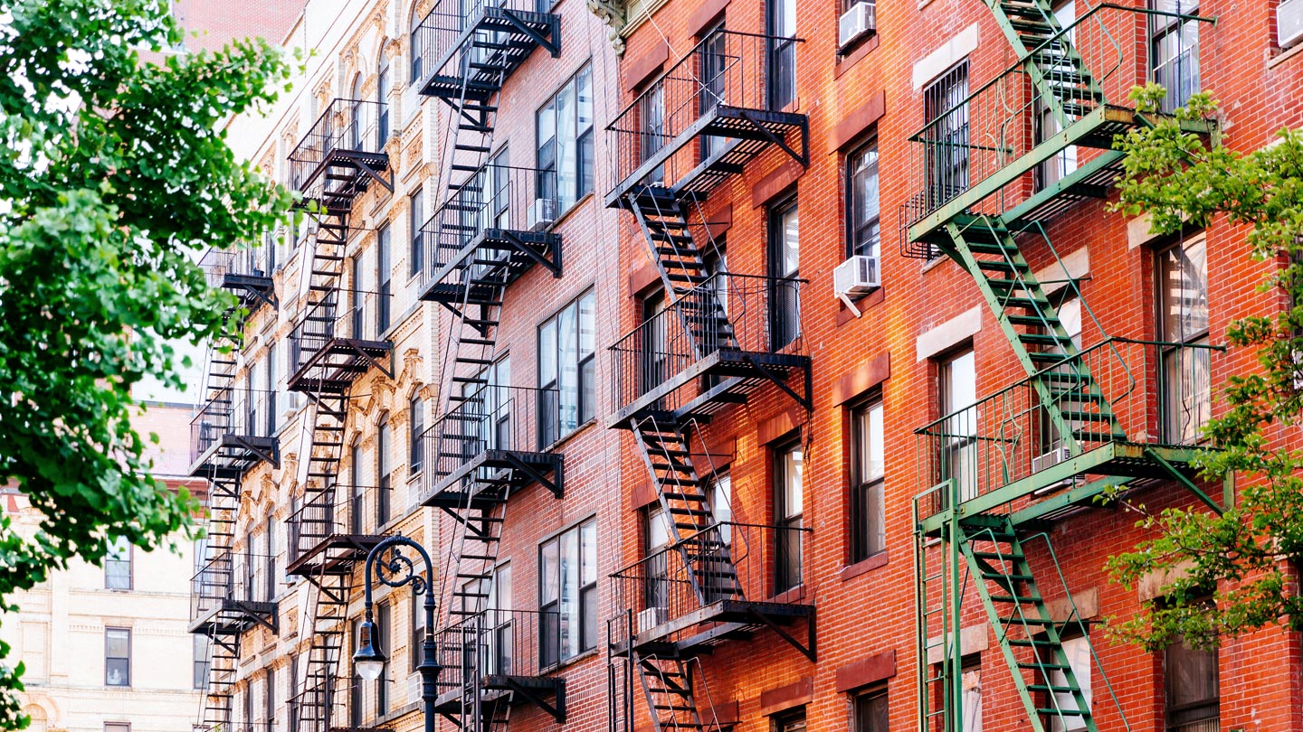 Apartment building with fire escapes