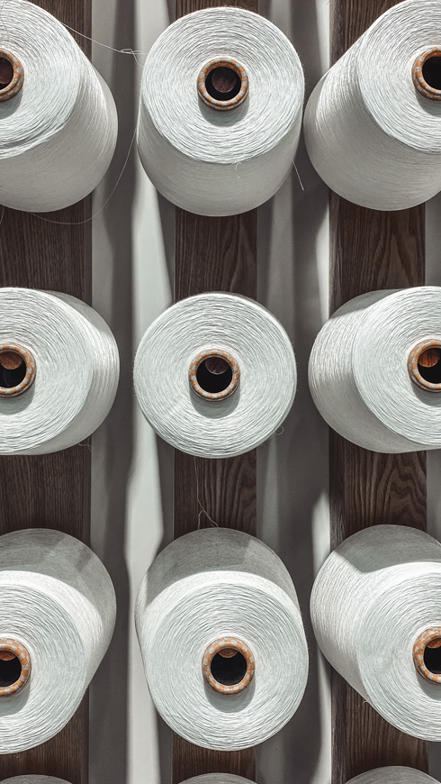 Yarn spools on displayed on a wall