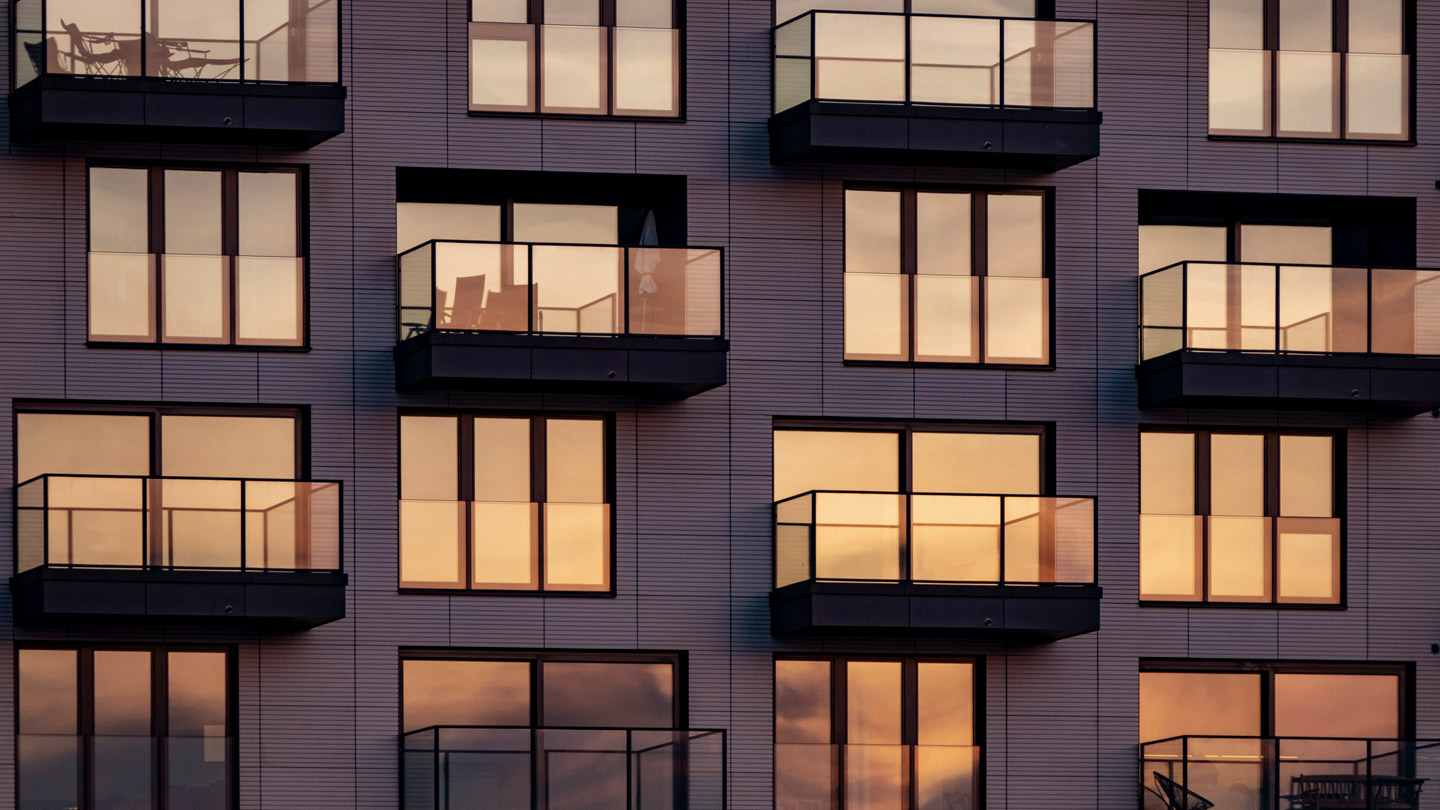 Building with balconies at sunset