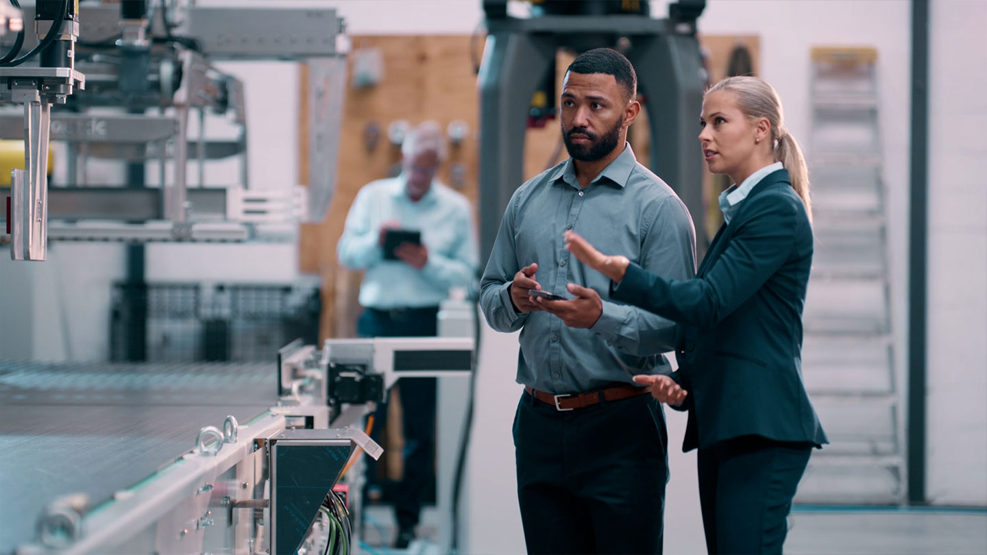 Two professionals in an industrial setting