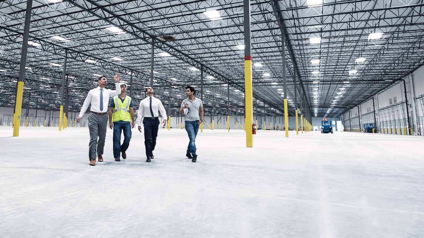 Professionals walking through warehouses