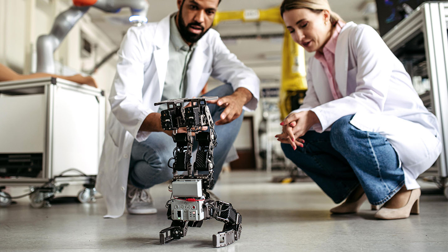 2 people testing on a robot banner
