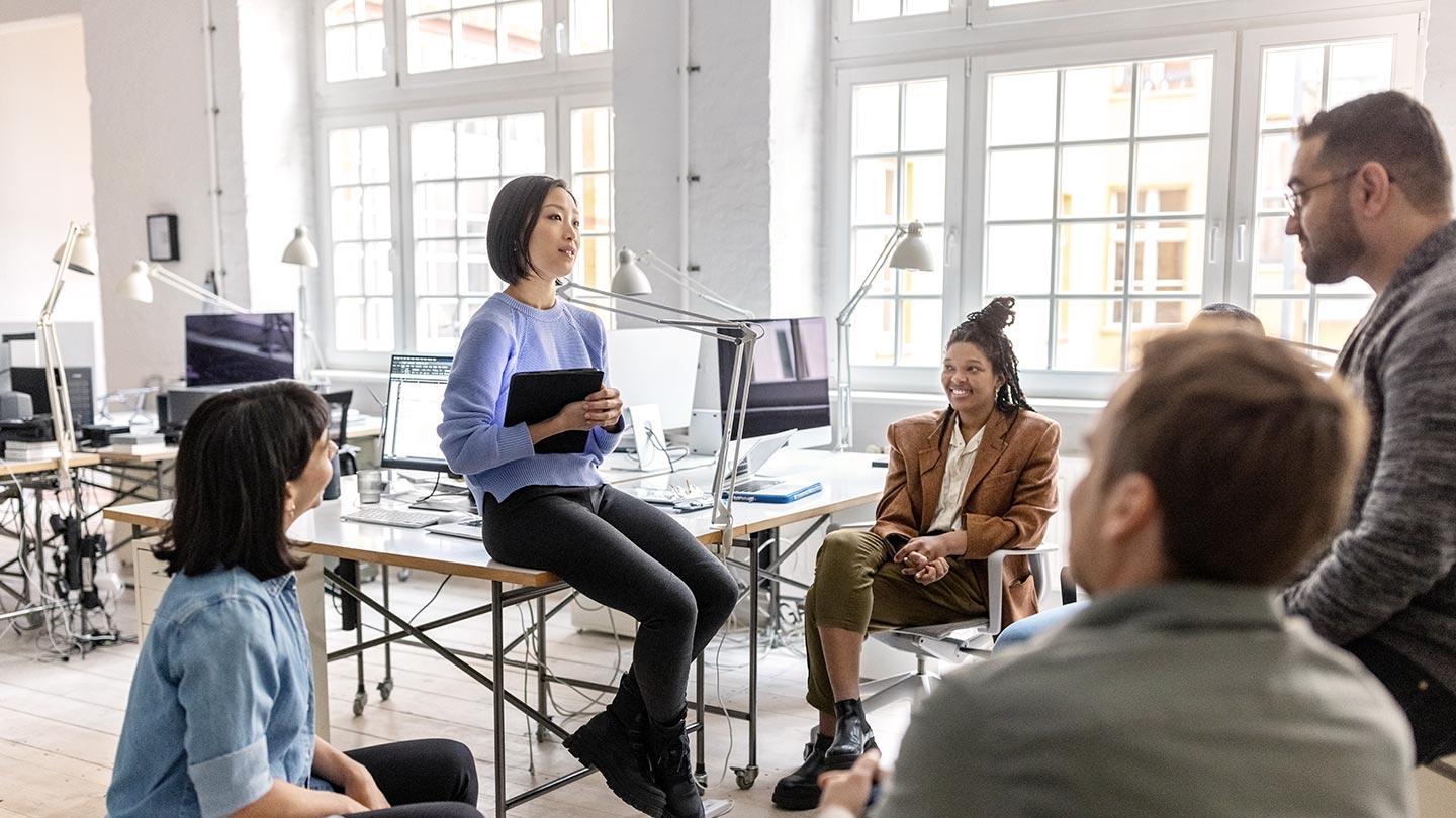 woman giving a meeting banner