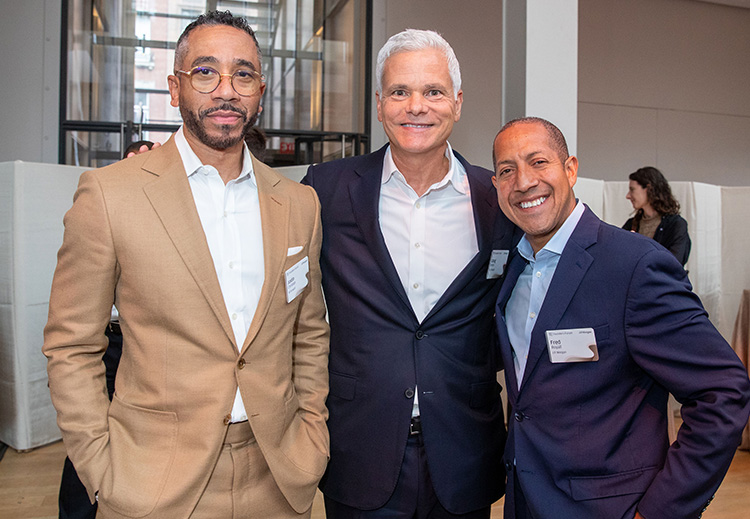 Three professionals smiling