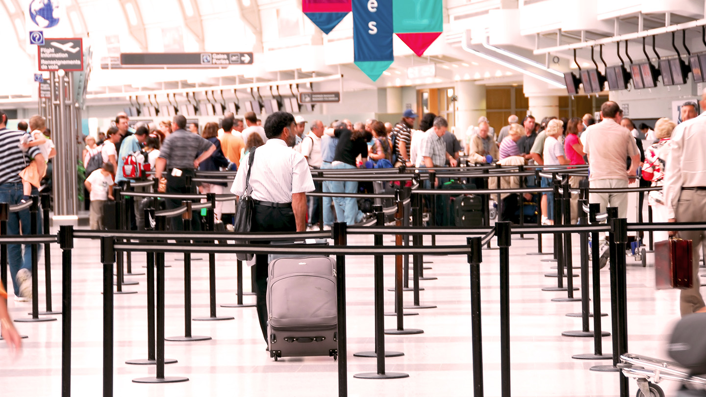 People in airport line. 