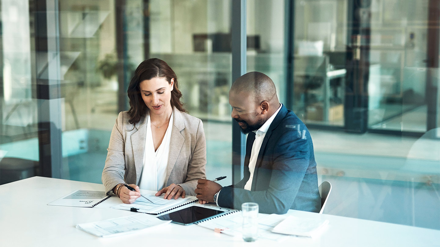 Two business people working