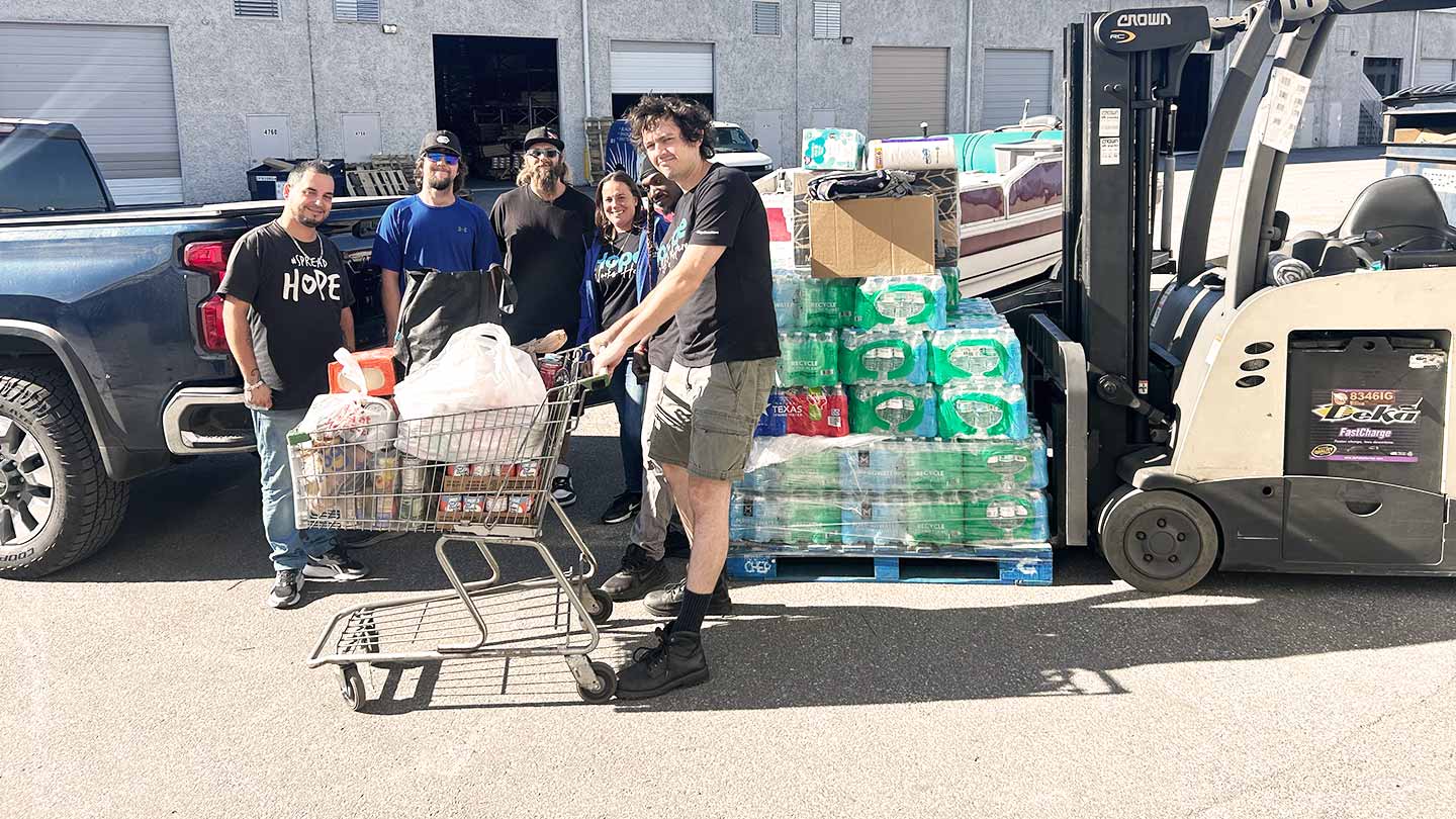 Ministry workers standing near donations
