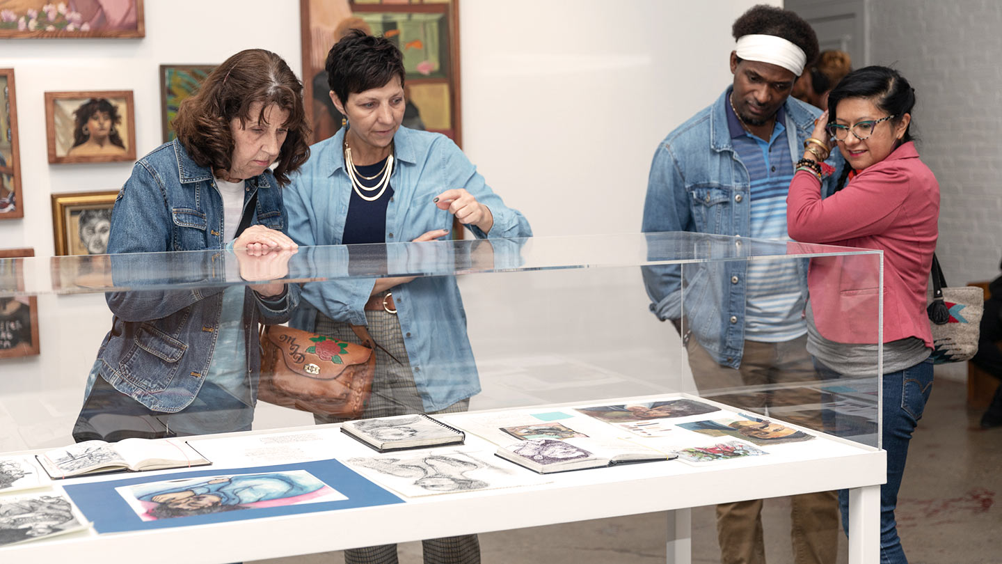 People viewing art in the main gallery of Tube Factory