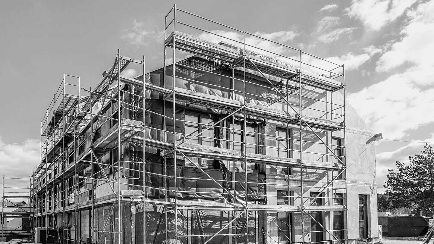 Building surrounded by scaffolding