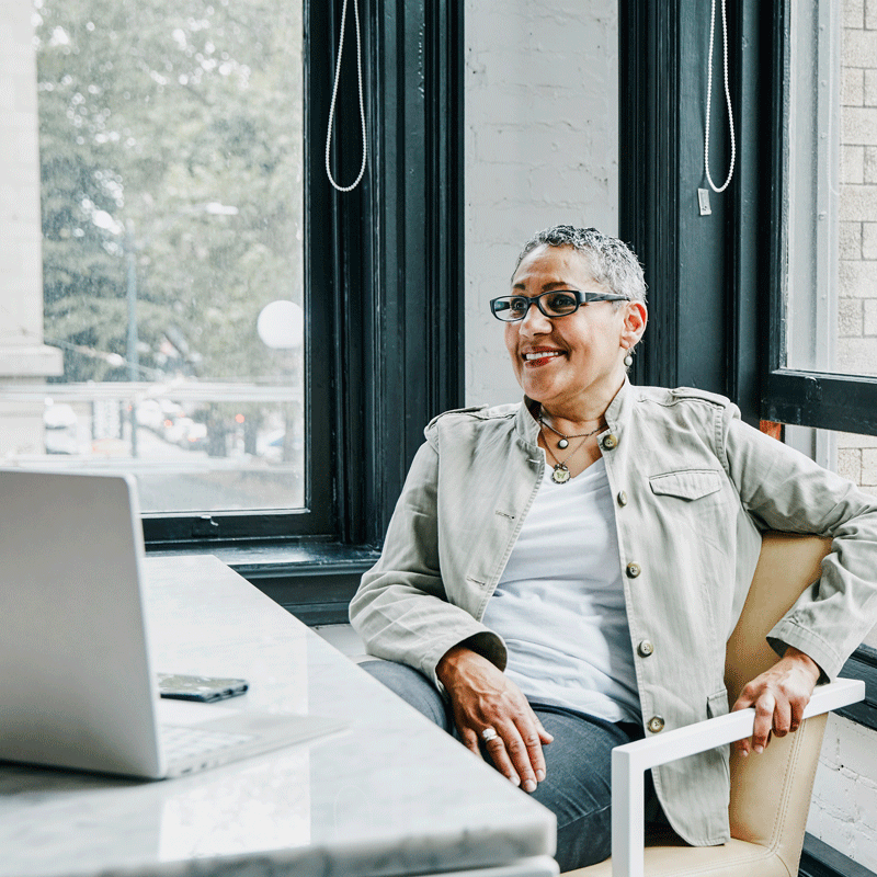 Person sitting in chair with laptop