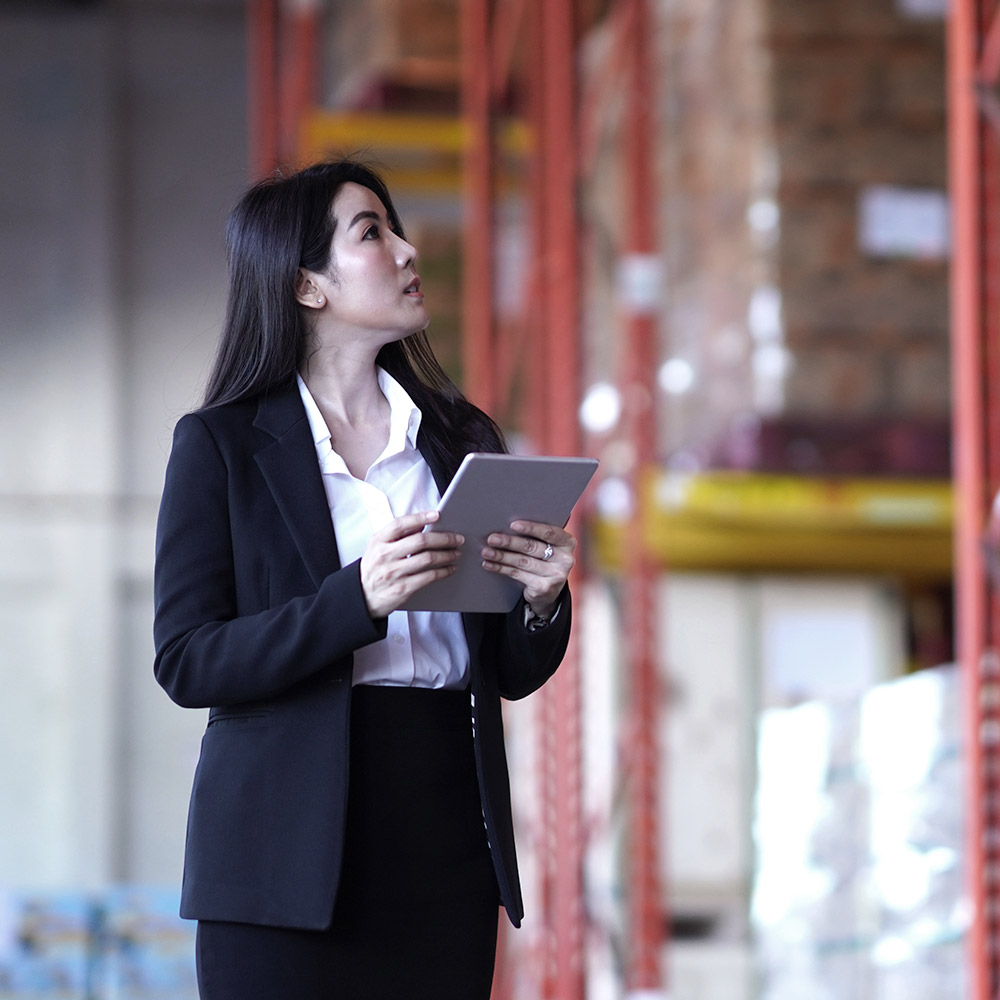 Professional holding tablet and looking up