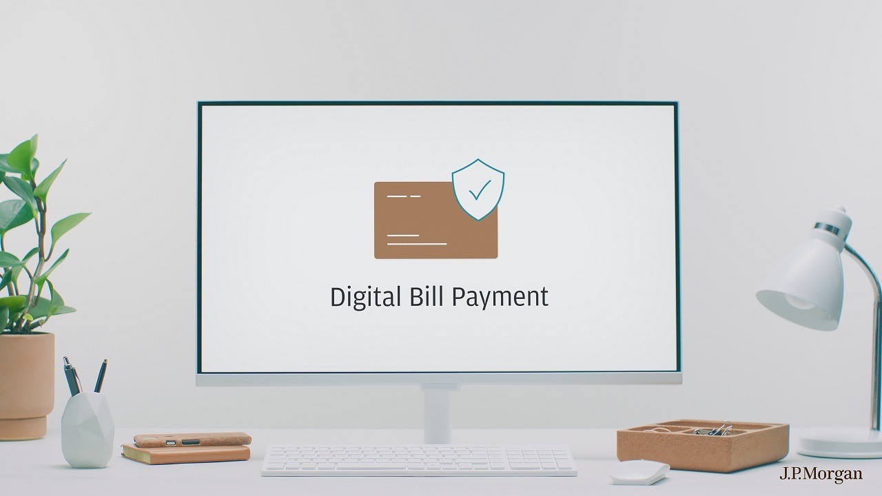 Computer at desk with digital bill payment on screen