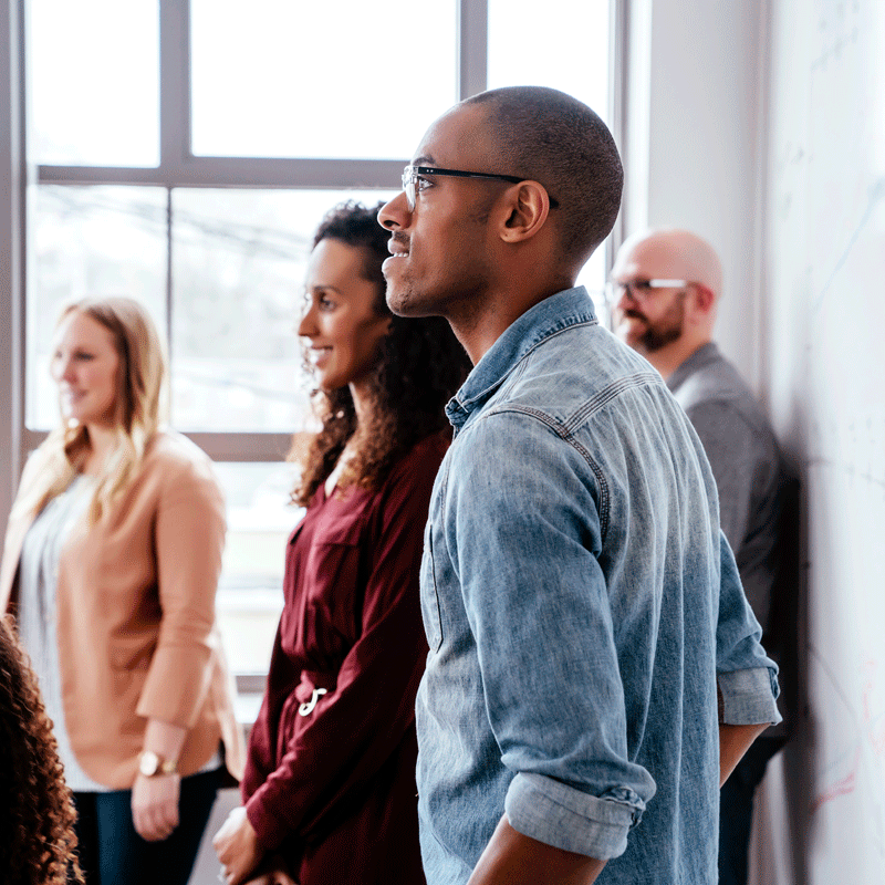 Group of people watching a presentation