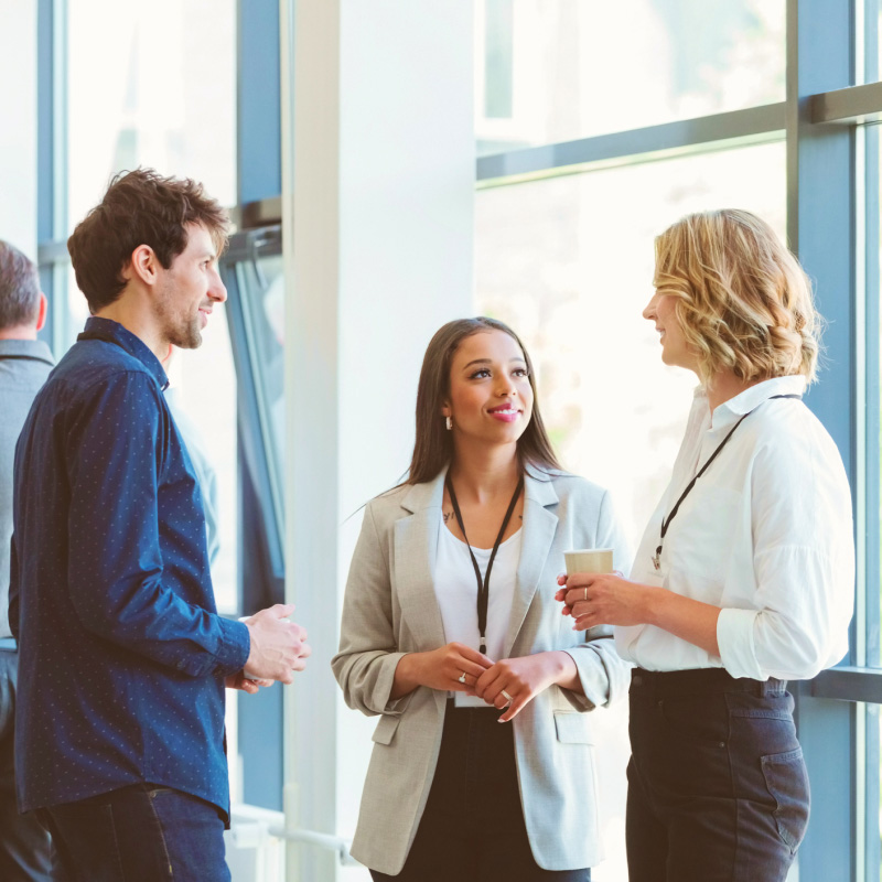 Three professionals chatting