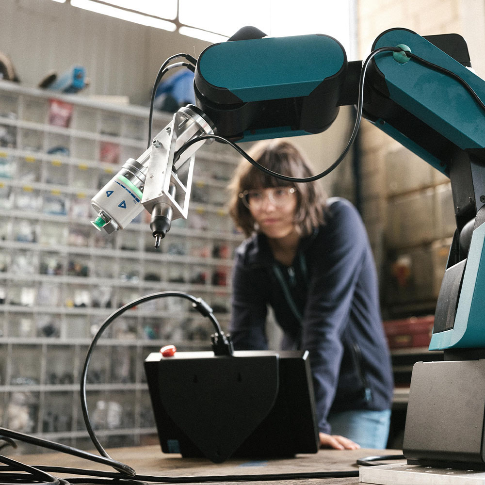 Individual working on a robotic arm