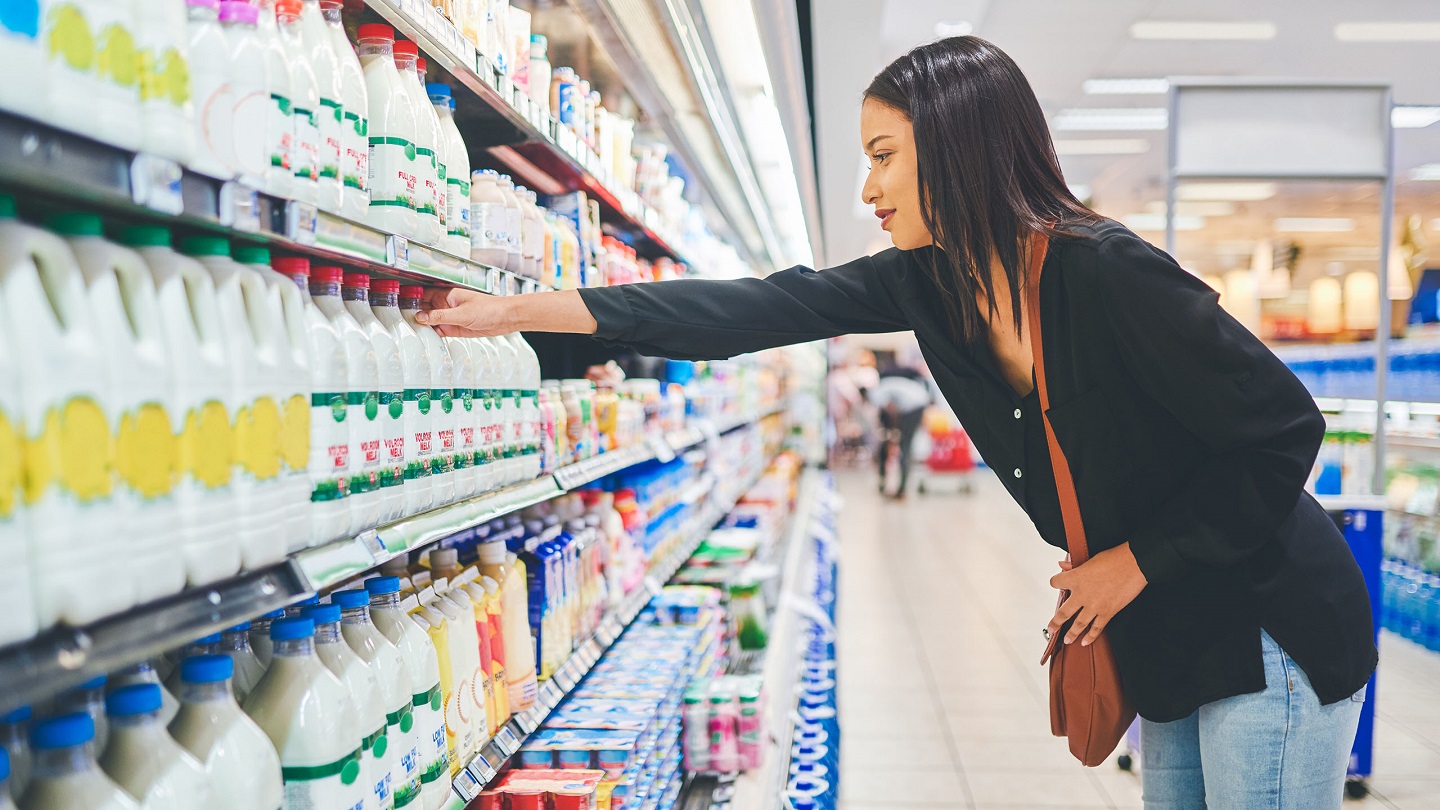 Shot of a young woman shopping in a grocery store