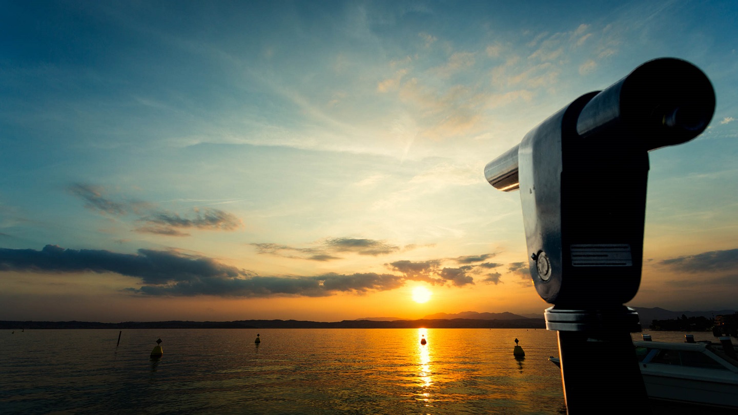 Old telescope and blue sky. Shot taken in Como lake, Italy, Europe