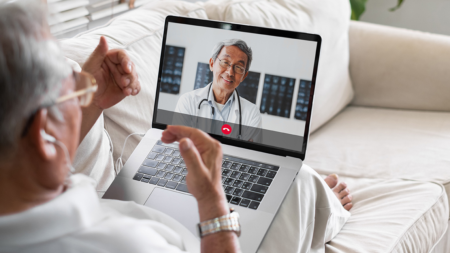 Asian senior video call with doctor telemedicine telehealth concept