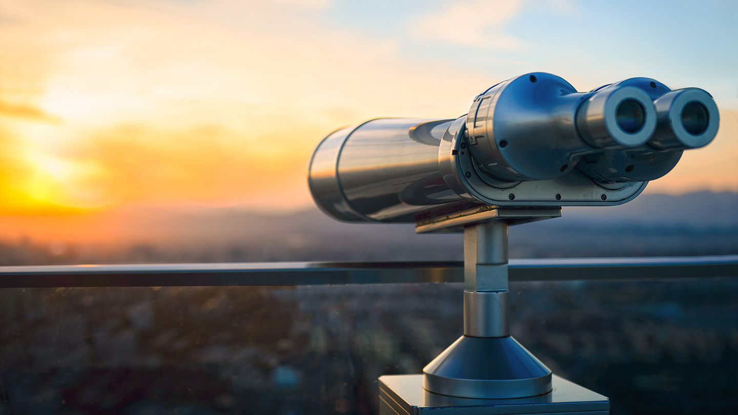 Binoculars or telescope on top of skyscraper at observation deck to admire the city skyline at sunset.Telescope located on the Beijing Olympic Tower