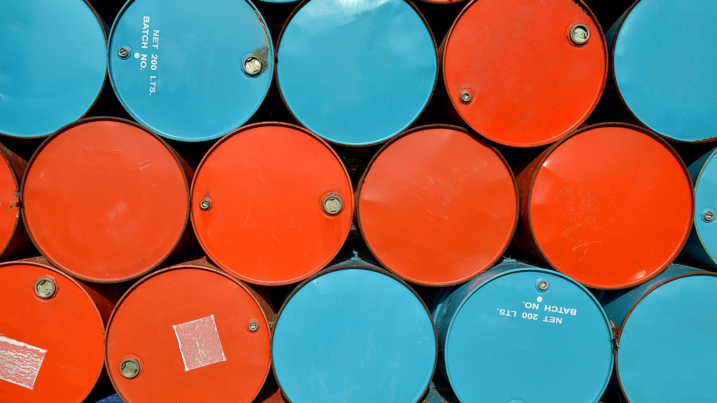 colorful of old oil tanks after uesd at outdoor junk place photo in sun lighting.