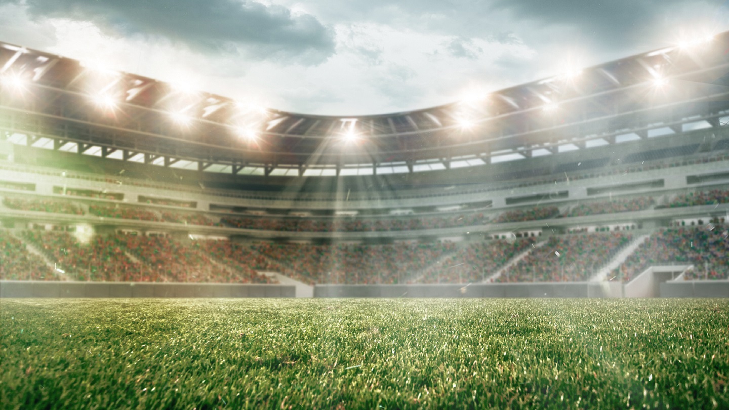 Soccer field with illumination, green grass and cloudy sky, background for design or advertising. 3D-model. Copyspace to insert your image or text. Concept of sport, active lifestyle, buildings.